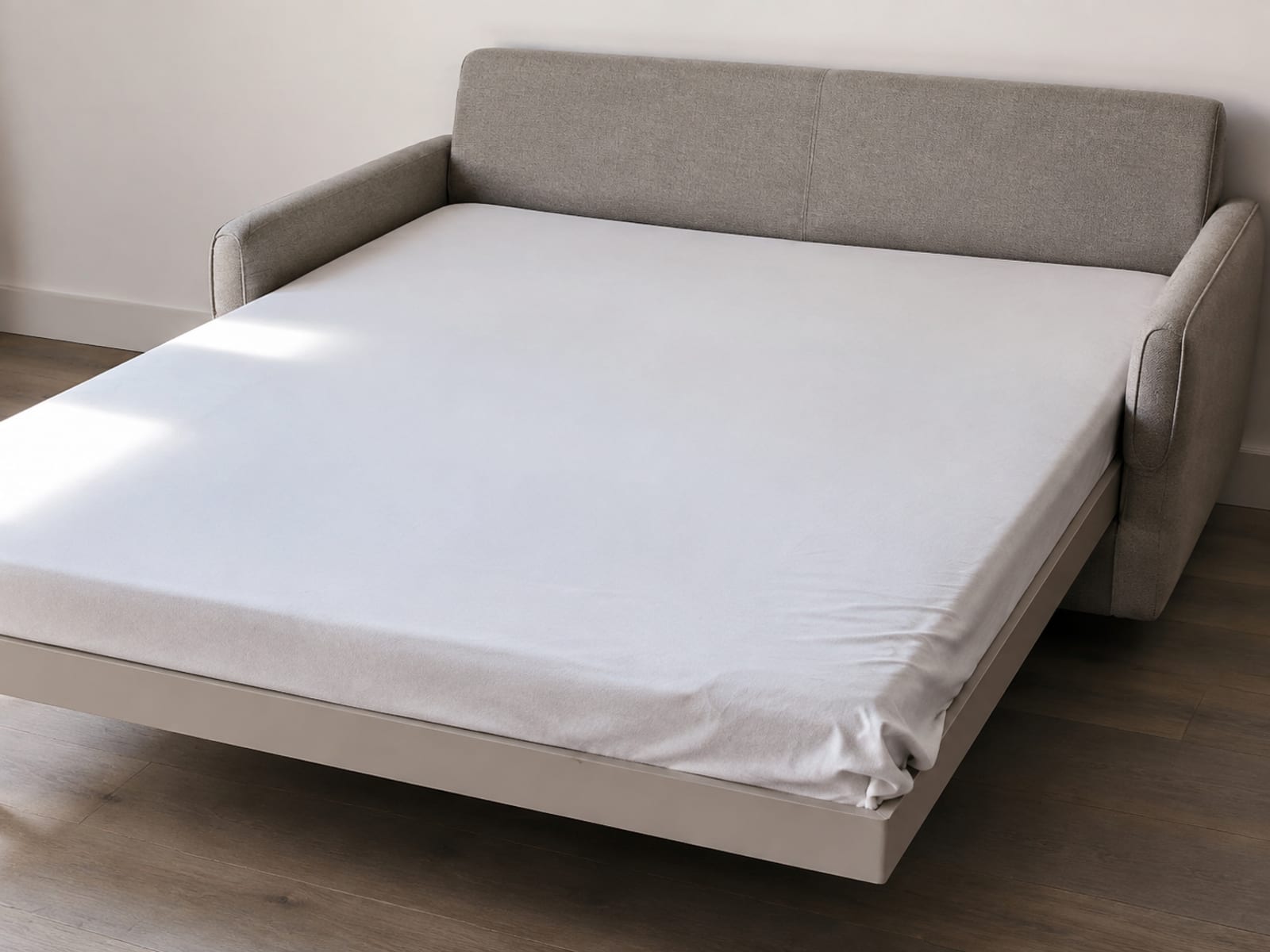 An opened pop-up platform sleeper showing one flat unbroken sleeping surface with no folding frame or crossbar beneath it